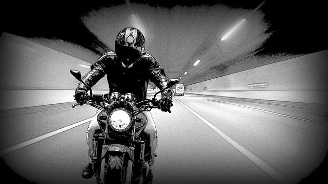 image of biker with jacket on motorcycle